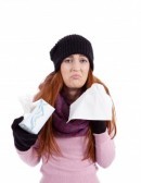 14424787-woman-with-tissue-and-spray-feels-unwell-with-flu-isolated-on-white