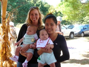 Nat from Thailand with her twin host children and host mother