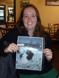 Amy with the picture of an excellent snowman build after the last snowstorm