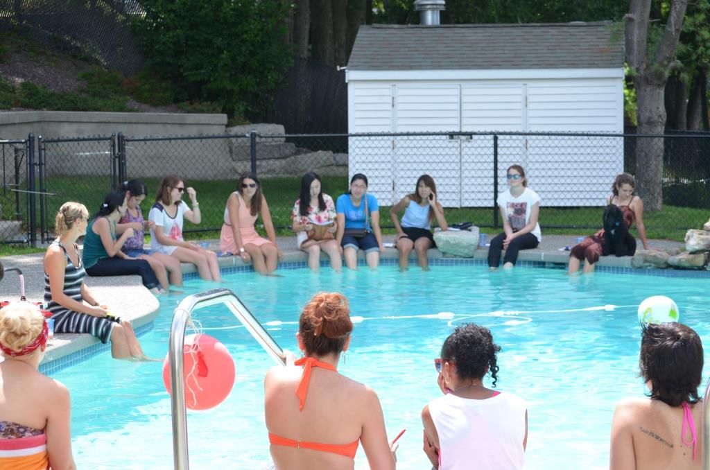 Talking about water safety while cooling of with the feet in the pool