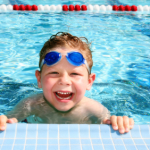 Happy child in a swimming pool
