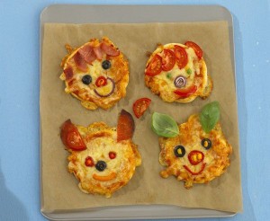 For directions on making these adorable pizzas, visit https://www.pinterest.com/pin/454863631087692146/