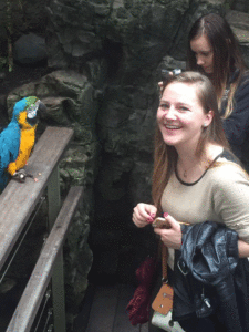 An au pair at the parrot exhibit at the Central Park Zoo