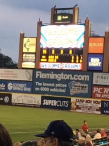 The scoreboard at a baseball game attended by au pairs and host families in New Jersey