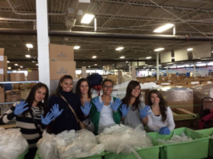 Smiling au pairs enjoy a day of community service.
