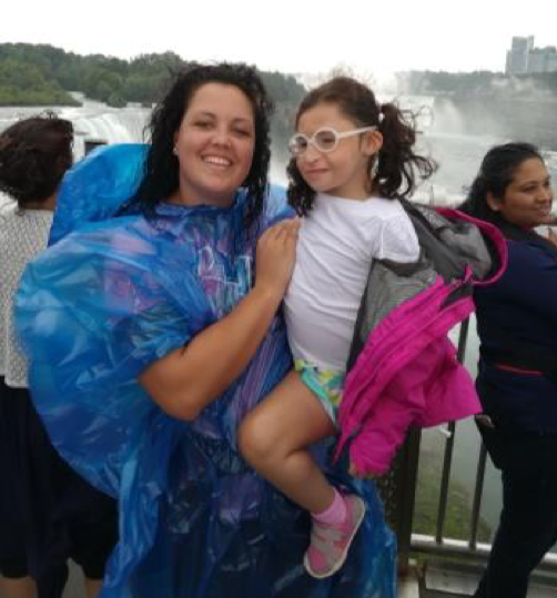 Rozelle Smiles While Holding Alana During Trip with Host Family | Au Pair in America