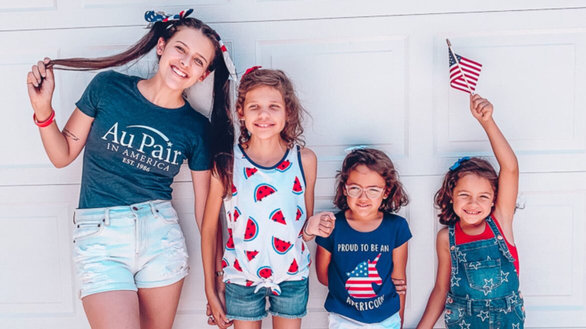 Au pair with three host children on Fourth of July