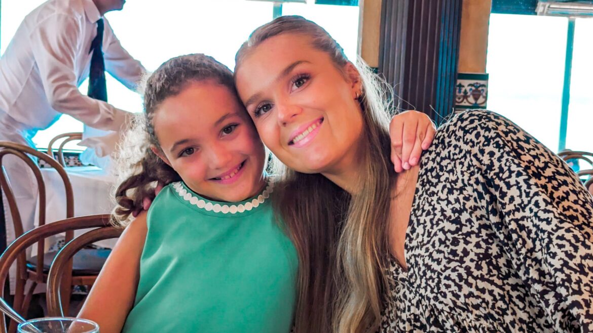 au pair from sweden with host child at a restaurant in florida