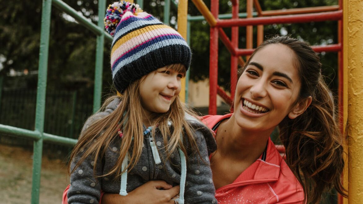au pair with child at playground