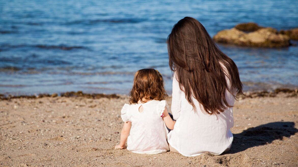 woman and child at the beach in california