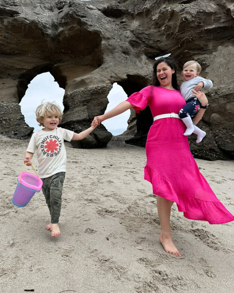 Benefits of hosting an au pair in the summer - au pair and host child at the beach