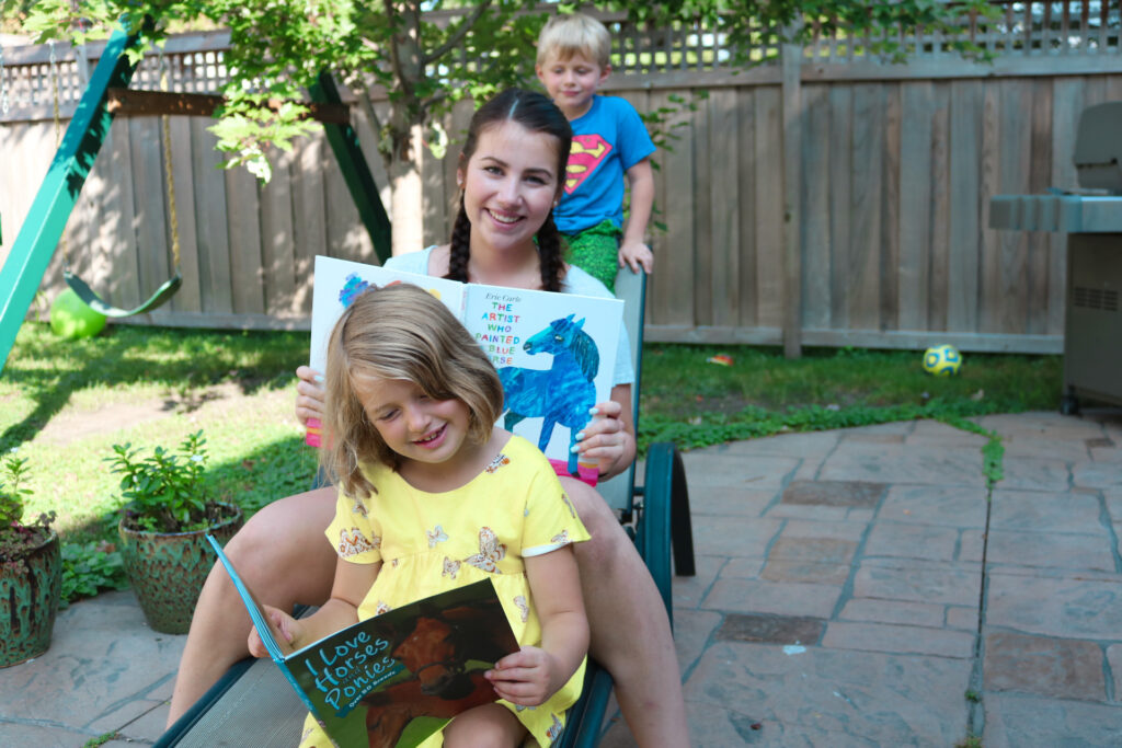 au pair and school aged children reading - Au Pair in America