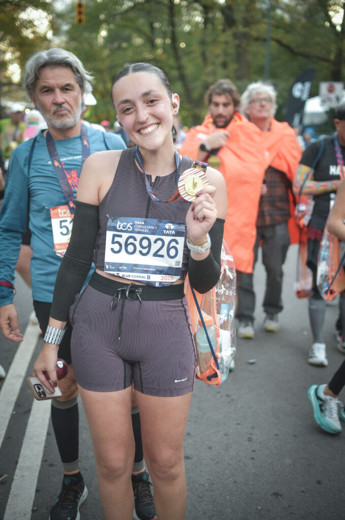 Au pair Méline after running in the 2025 NYC Marathon