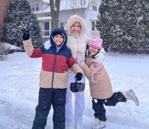Au pair from Thailand in Illinois on a snow day with her host children