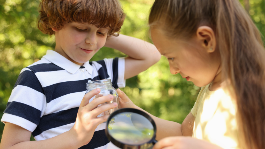 Children magnifying nature outside
