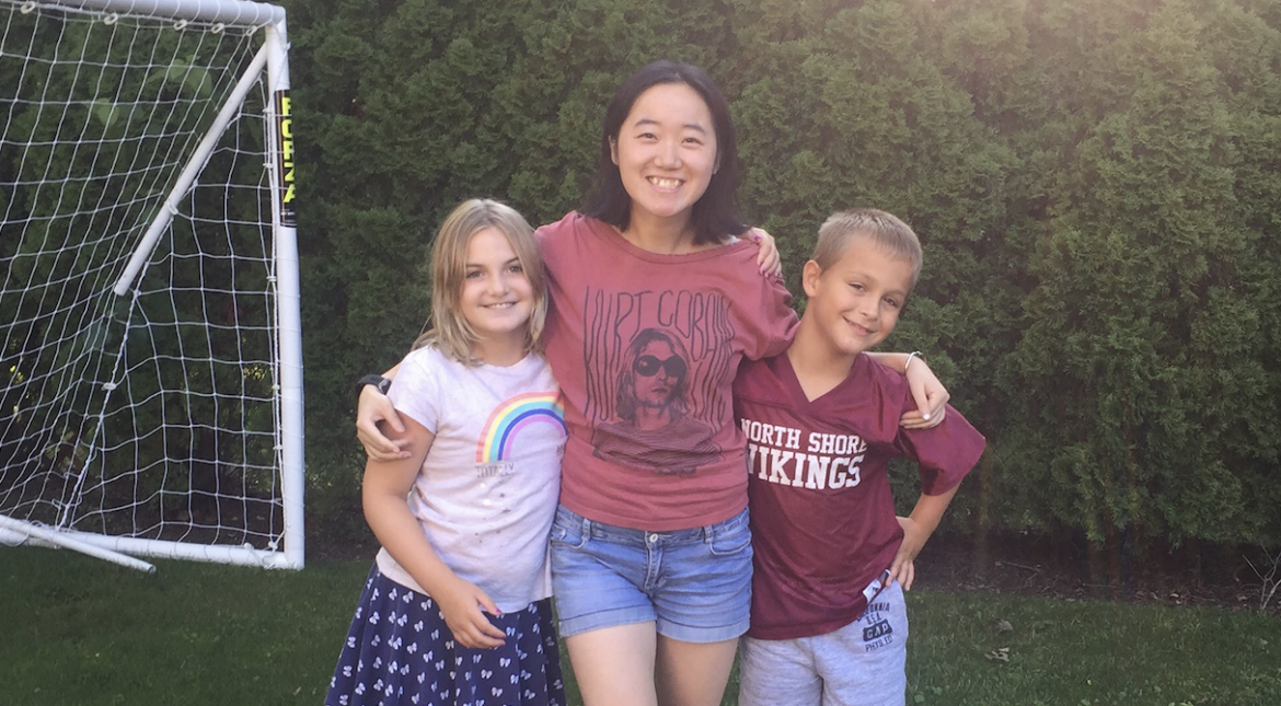 au pair and host children outside