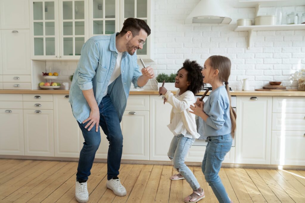 Family Dancing at Home in the Kitchen