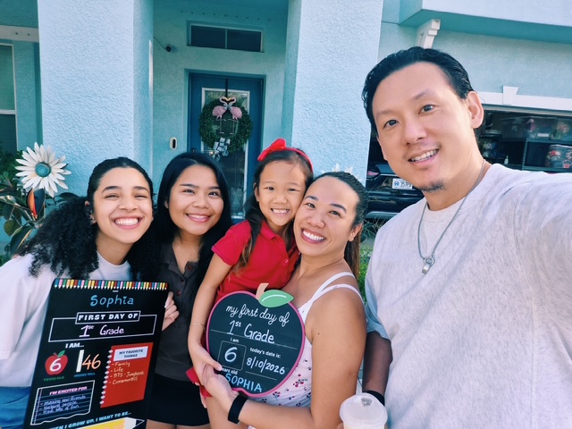 Au pair and host family celebrating the first day of school