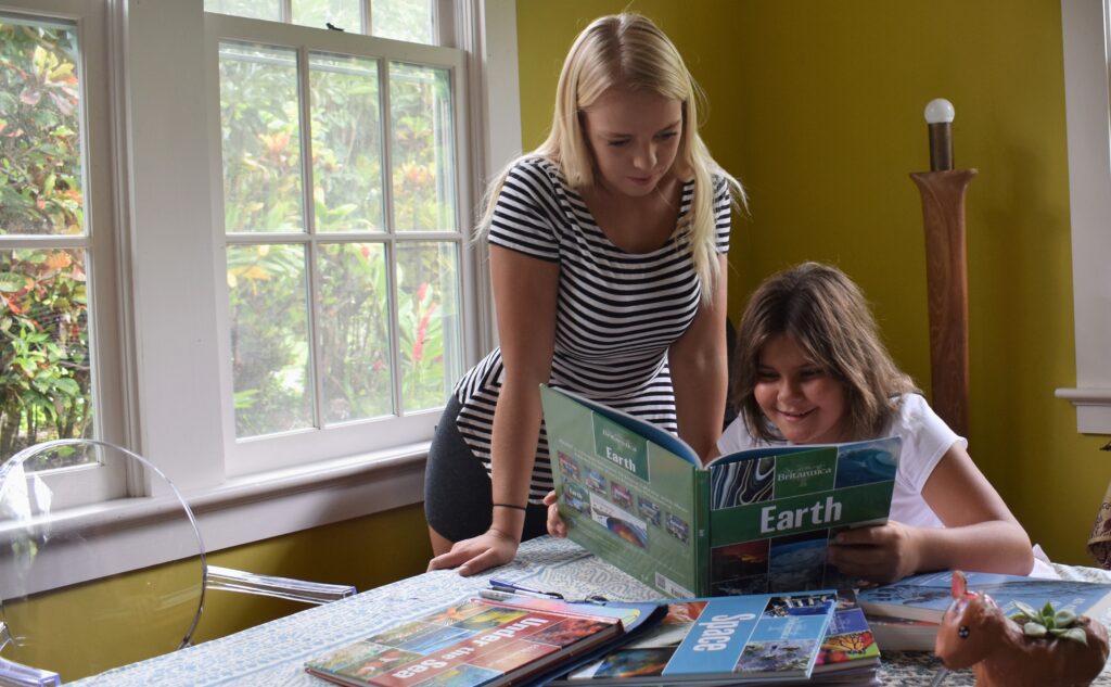 au pair and host child reading