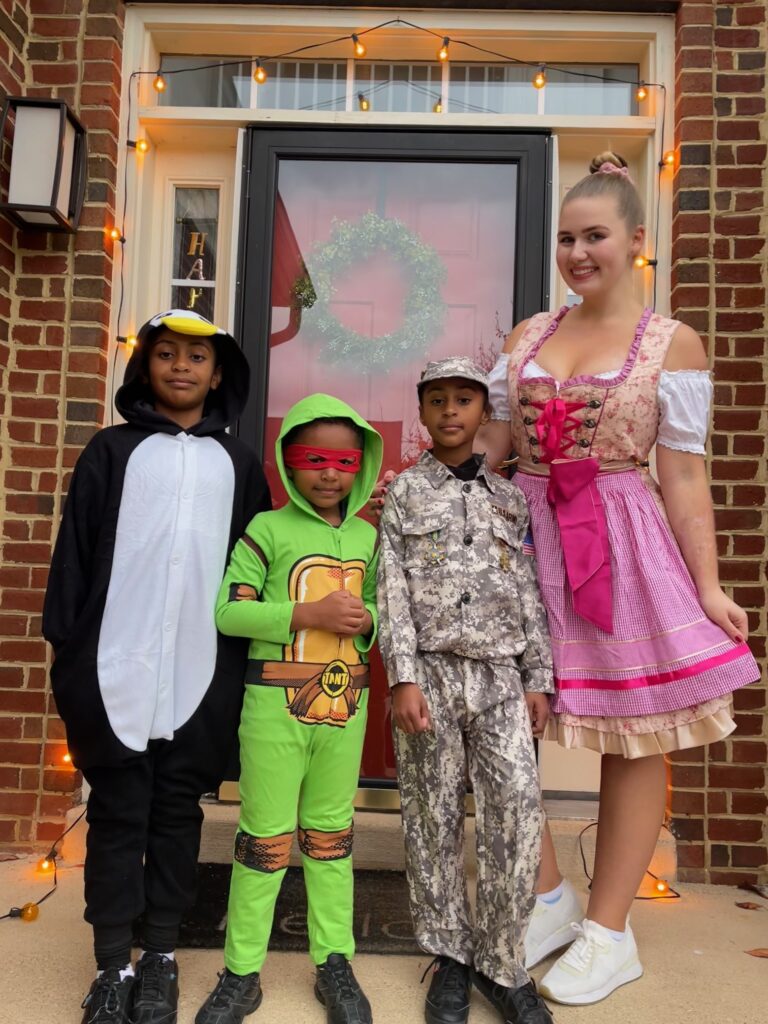 Au pair from Germany and host children on Halloween