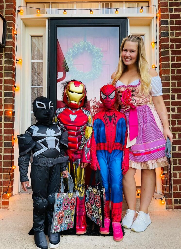 Host family and au pair on Halloween