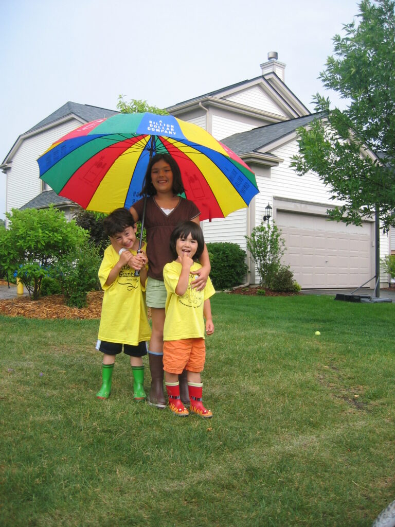 Children out playing in the rain